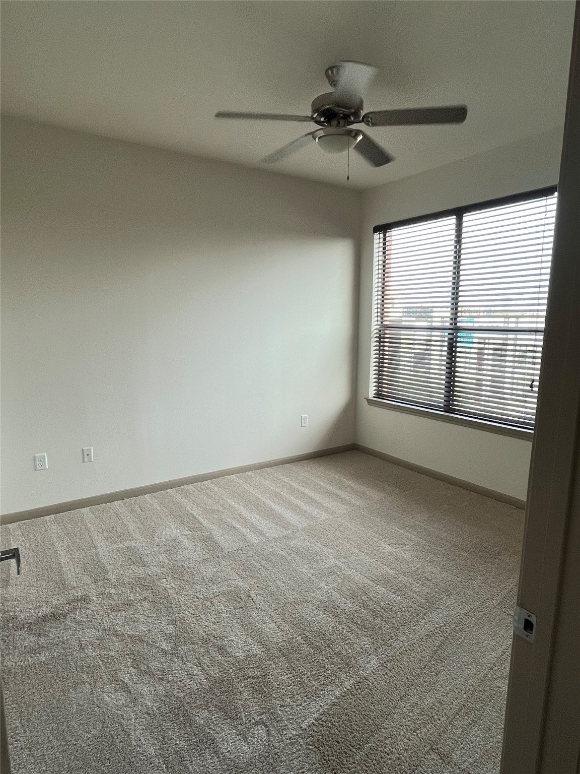 2700 Brazos Street, Unit 4515 Houston, TX 77006 - Photo 6 of 20 a view of an empty room with a window