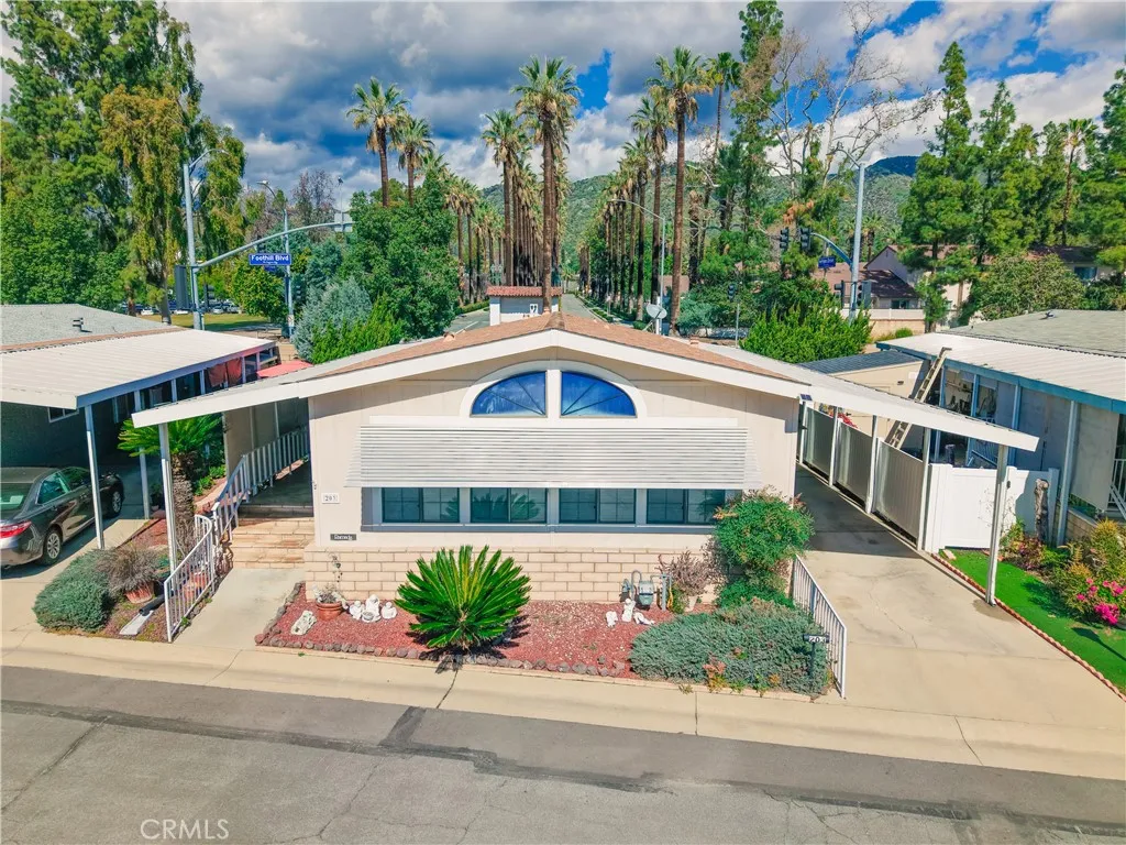 840 East Foothill Boulevard, Unit 203 Azusa, CA 91702 - Photo 1 of 45 front view of a house with a yard