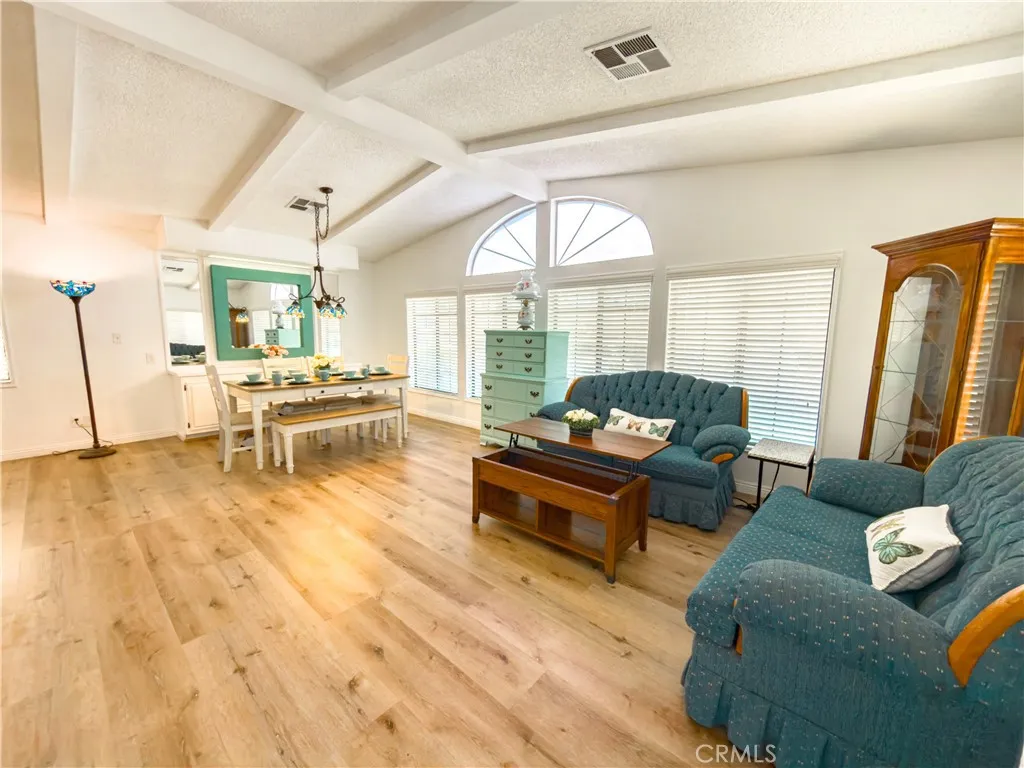 840 East Foothill Boulevard, Unit 203 Azusa, CA 91702 - Photo 12 of 45 a living room with furniture and a large window