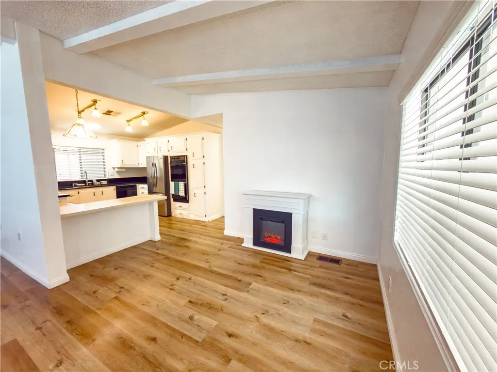 840 East Foothill Boulevard, Unit 203 Azusa, CA 91702 - Photo 13 of 45 a view of open kitchen with granite countertop window and a sink