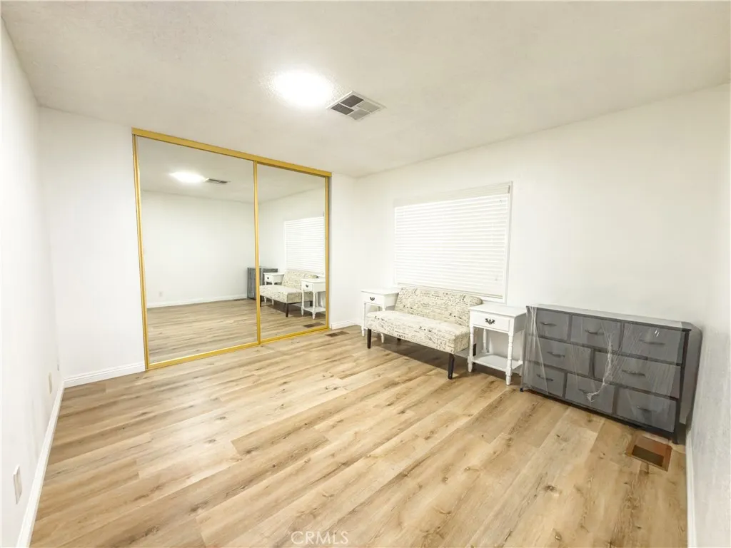840 East Foothill Boulevard, Unit 203 Azusa, CA 91702 - Photo 18 of 45 a room with a bed and furniture