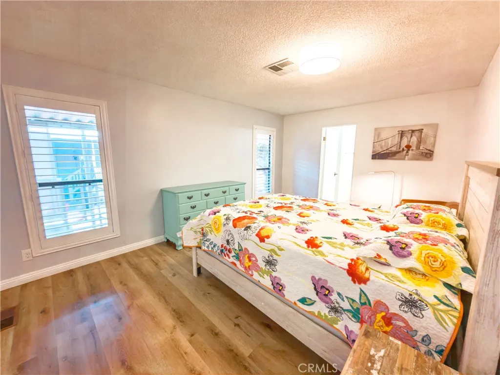 840 East Foothill Boulevard, Unit 203 Azusa, CA 91702 - Photo 20 of 45 a bedroom with a bed and a window