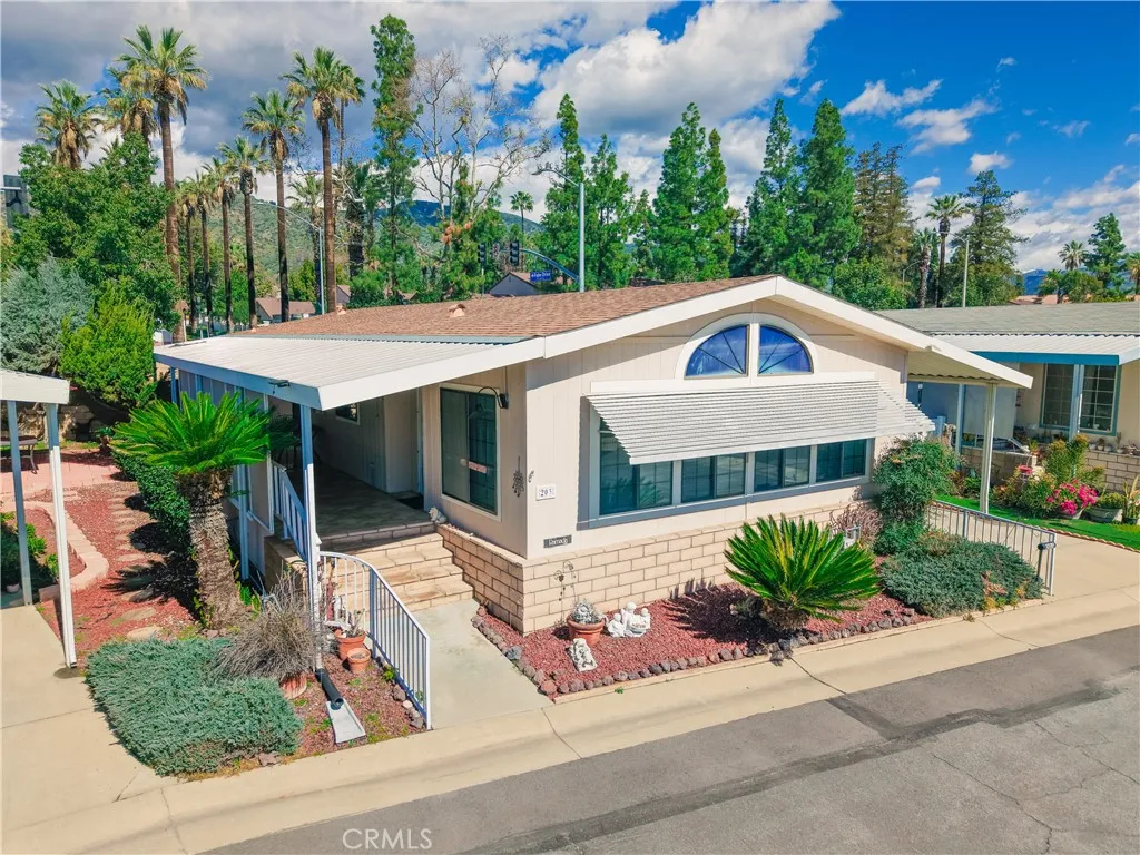 840 East Foothill Boulevard, Unit 203 Azusa, CA 91702 - Photo 2 of 45 a front view of a house with a yard garage and outdoor seating