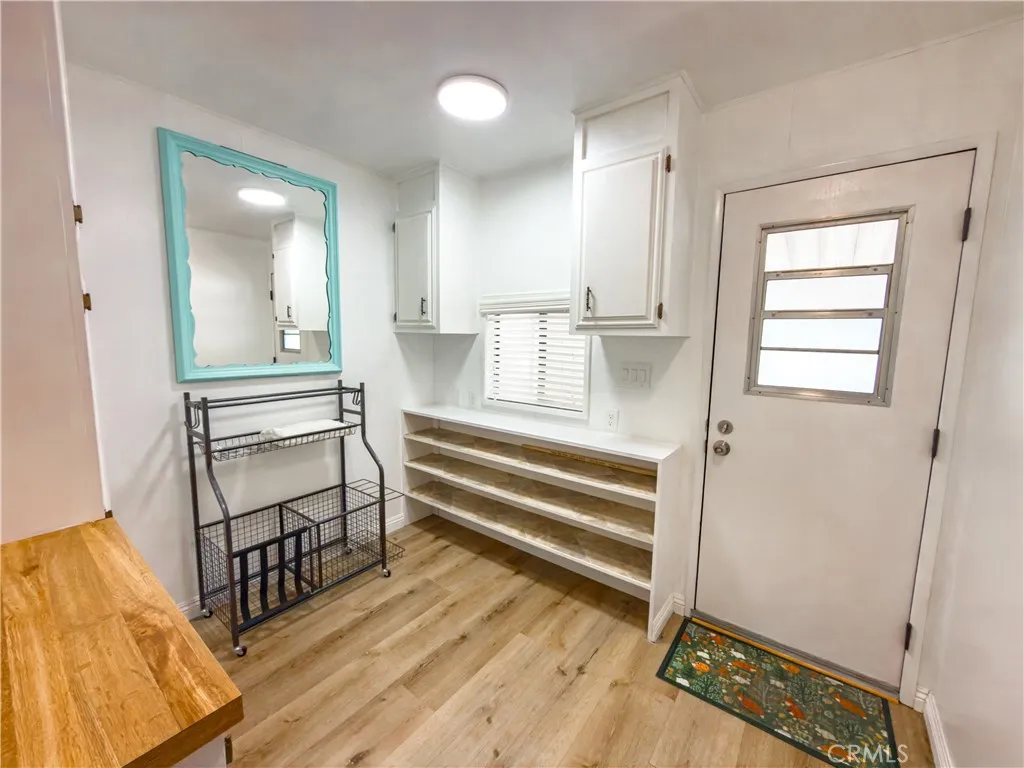 840 East Foothill Boulevard, Unit 203 Azusa, CA 91702 - Photo 27 of 45 a view of room with window and wooden floor