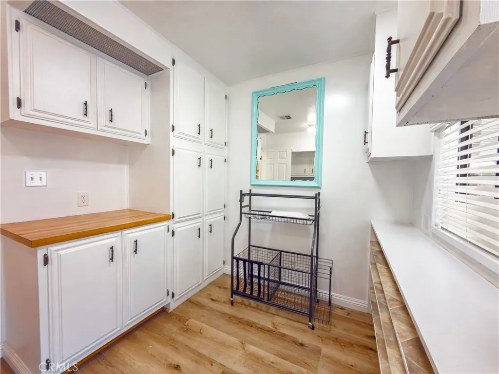 840 East Foothill Boulevard, Unit 203 Azusa, CA 91702 - Photo 28 of 45 a kitchen with granite countertop white cabinets and white appliances