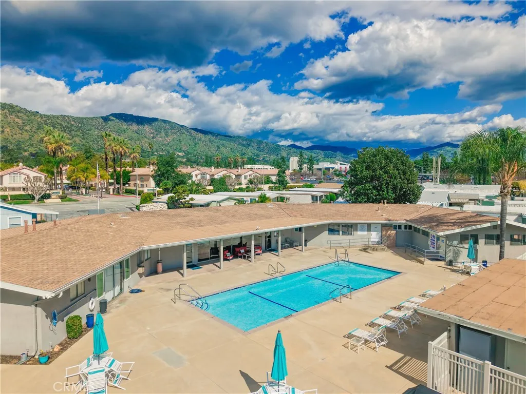 840 East Foothill Boulevard, Unit 203 Azusa, CA 91702 - Photo 35 of 45 a view of a swimming pool with an outdoor seating