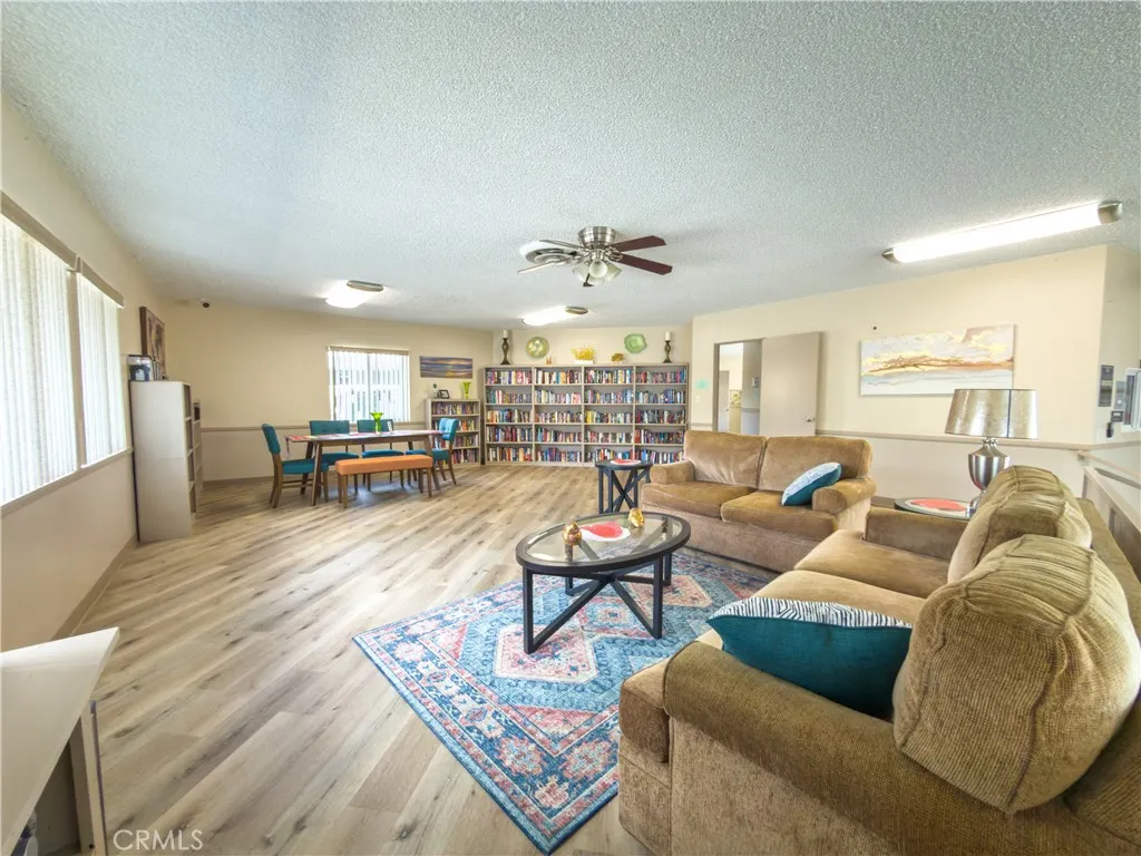840 East Foothill Boulevard, Unit 203 Azusa, CA 91702 - Photo 38 of 45 a living room with furniture and wooden floor