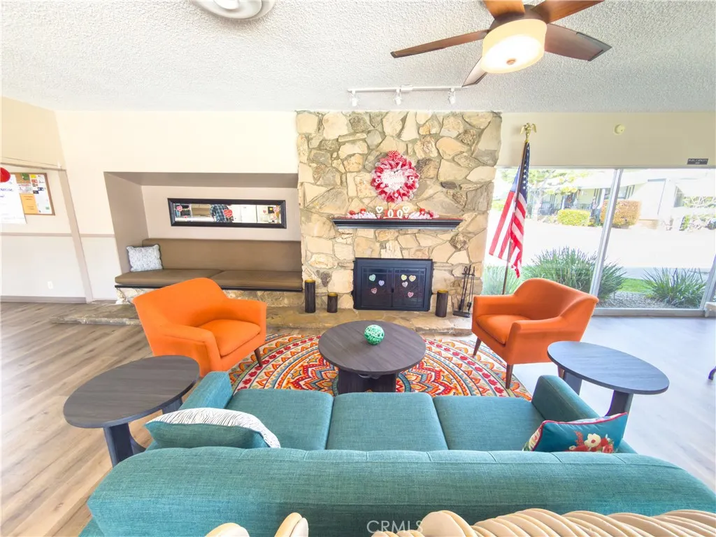 840 East Foothill Boulevard, Unit 203 Azusa, CA 91702 - Photo 40 of 45 a living room with furniture and a flat screen tv
