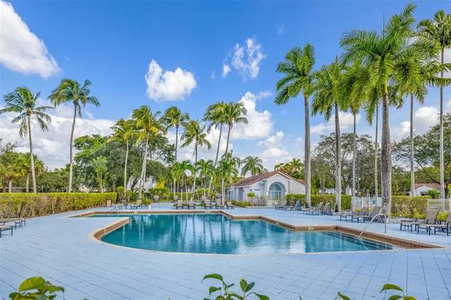 a view of a swimming pool and an outdoor space