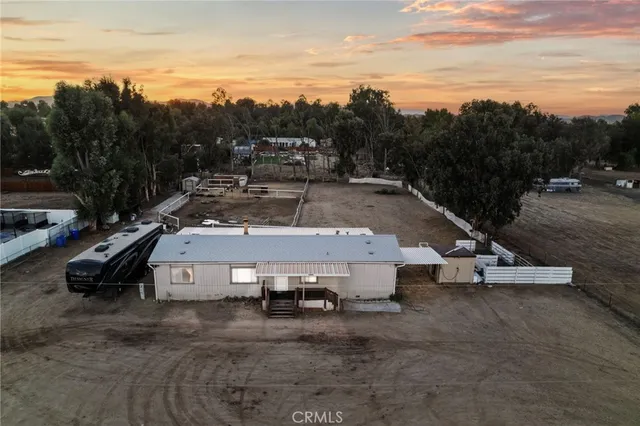 a view of a swimming pool with a yard and mountain view
