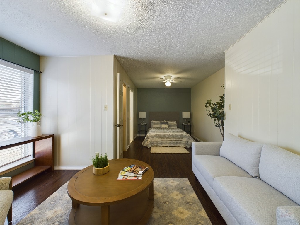 5300 Guadalupe Street, Unit 6201 Austin, TX 78751 - Photo 1 of 12 a living room with furniture and a potted plant