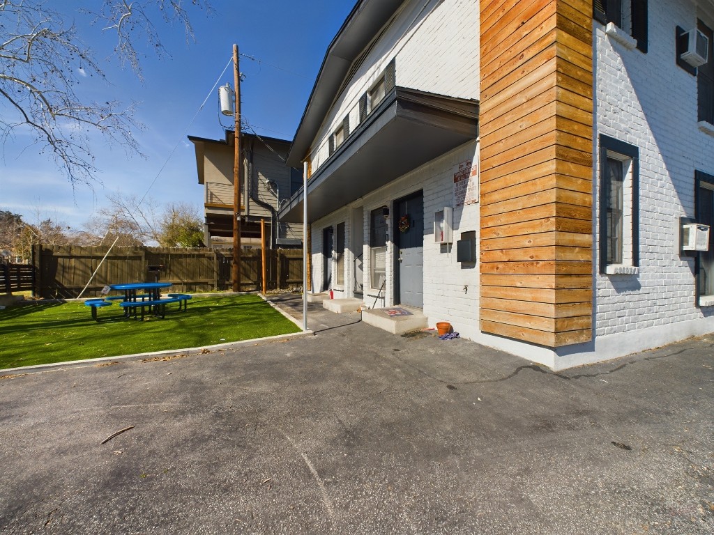 5300 Guadalupe Street, Unit 6201 Austin, TX 78751 - Photo 11 of 12 a view of a house with a yard and pathway
