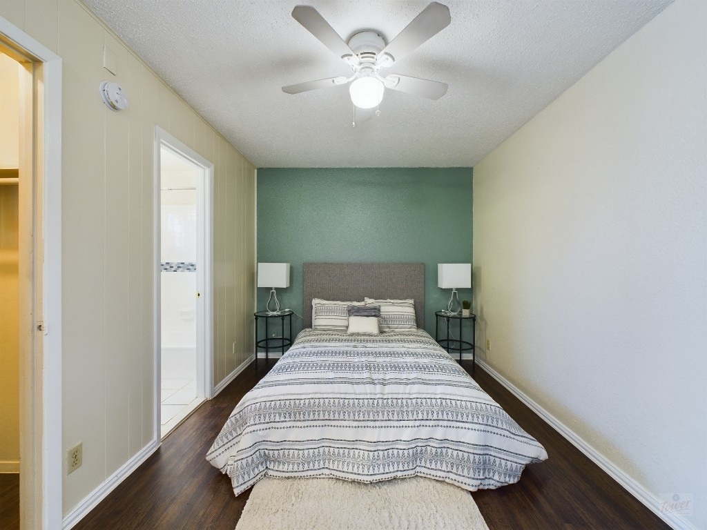 5300 Guadalupe Street, Unit 6201 Austin, TX 78751 - Photo 6 of 12 a bedroom with a bed and a chandelier