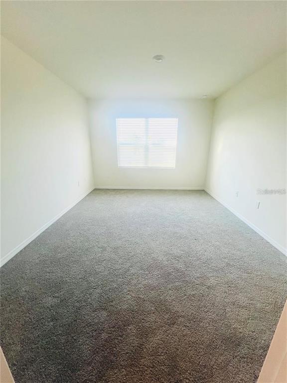 2598 Trinidad Road Haines City, FL 33844 - Photo 13 of 18 an empty room with a window