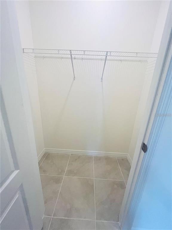 2598 Trinidad Road Haines City, FL 33844 - Photo 15 of 18 a view of a room with racks on the wall