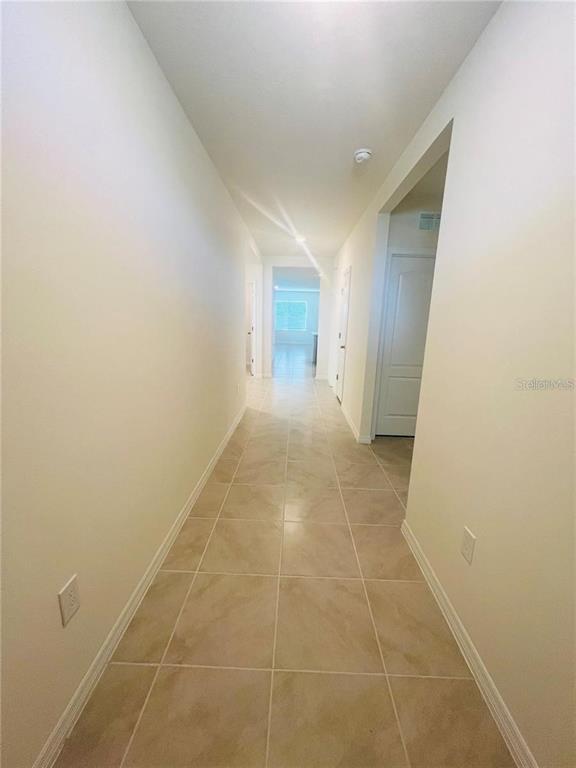 2598 Trinidad Road Haines City, FL 33844 - Photo 2 of 18 a view of hallway with a window and a door