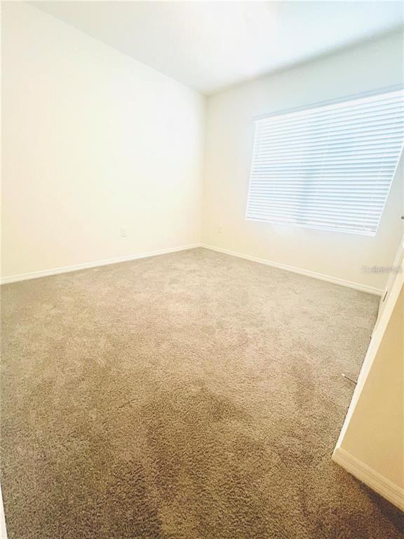 2598 Trinidad Road Haines City, FL 33844 - Photo 3 of 18 a view of an empty room and window