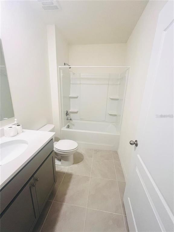 2598 Trinidad Road Haines City, FL 33844 - Photo 4 of 18 a bathroom with a sink a toilet and shower