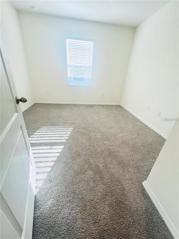 2598 Trinidad Road Haines City, FL 33844 - Photo 6 of 18 a view of a room with wooden floor
