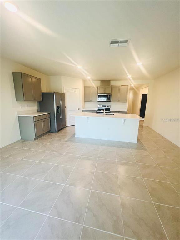 2598 Trinidad Road Haines City, FL 33844 - Photo 8 of 18 a large room with a table and chairs