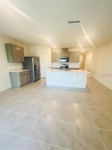 a view of a kitchen with a sink