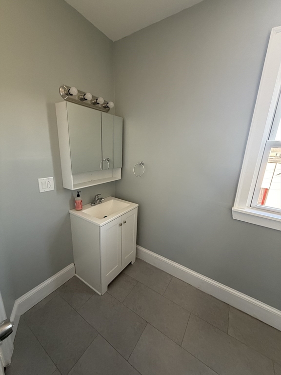 49 Federal Street, Unit 3 Beverly, MA 01915 - Photo 9 of 10 a utility room with dryer and washer