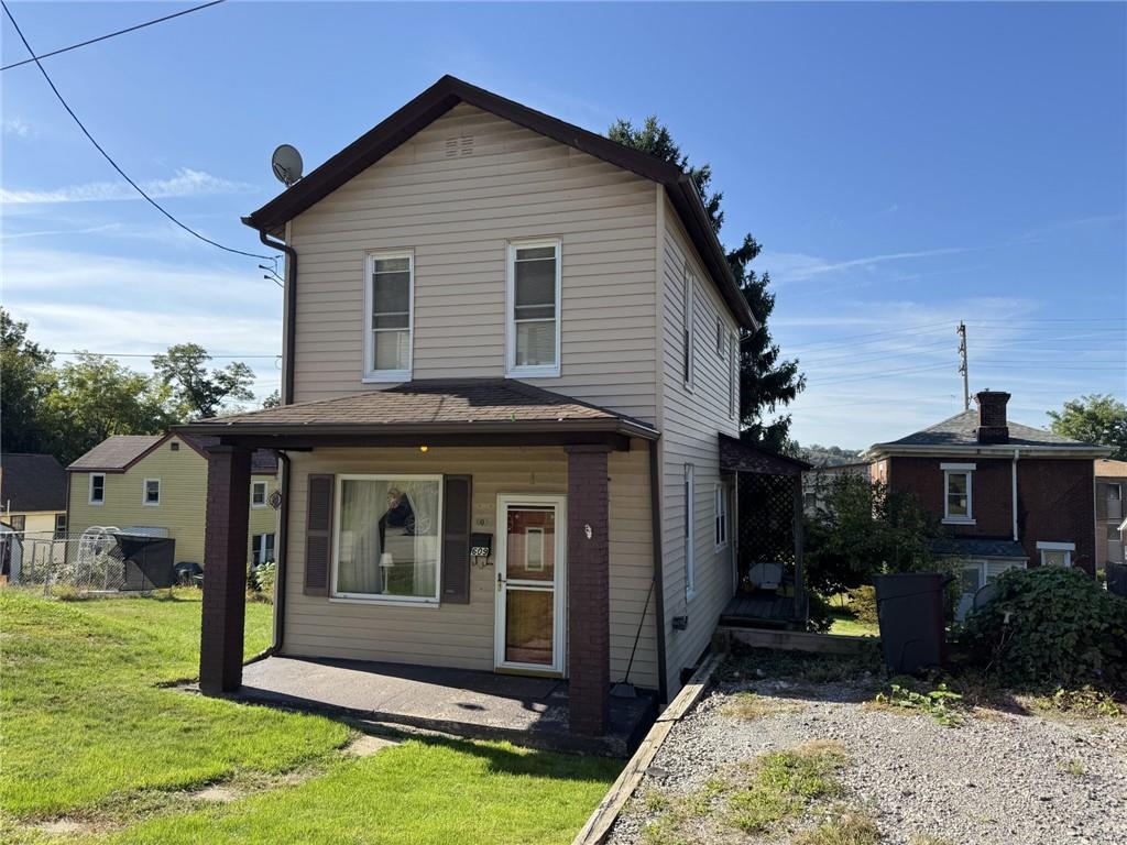 a front view of a house with a yard