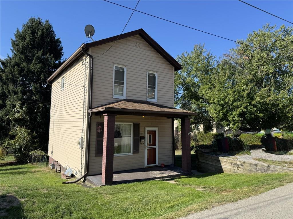 609 Lincoln Street Rochester, PA 15074 - Photo 20 of 24 a view of front of a house with a yard