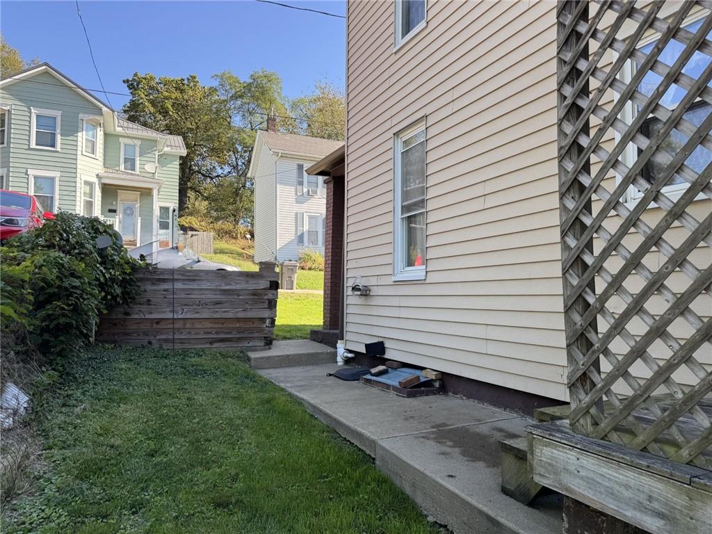 609 Lincoln Street Rochester, PA 15074 - Photo 21 of 24 a view of a house with a backyard