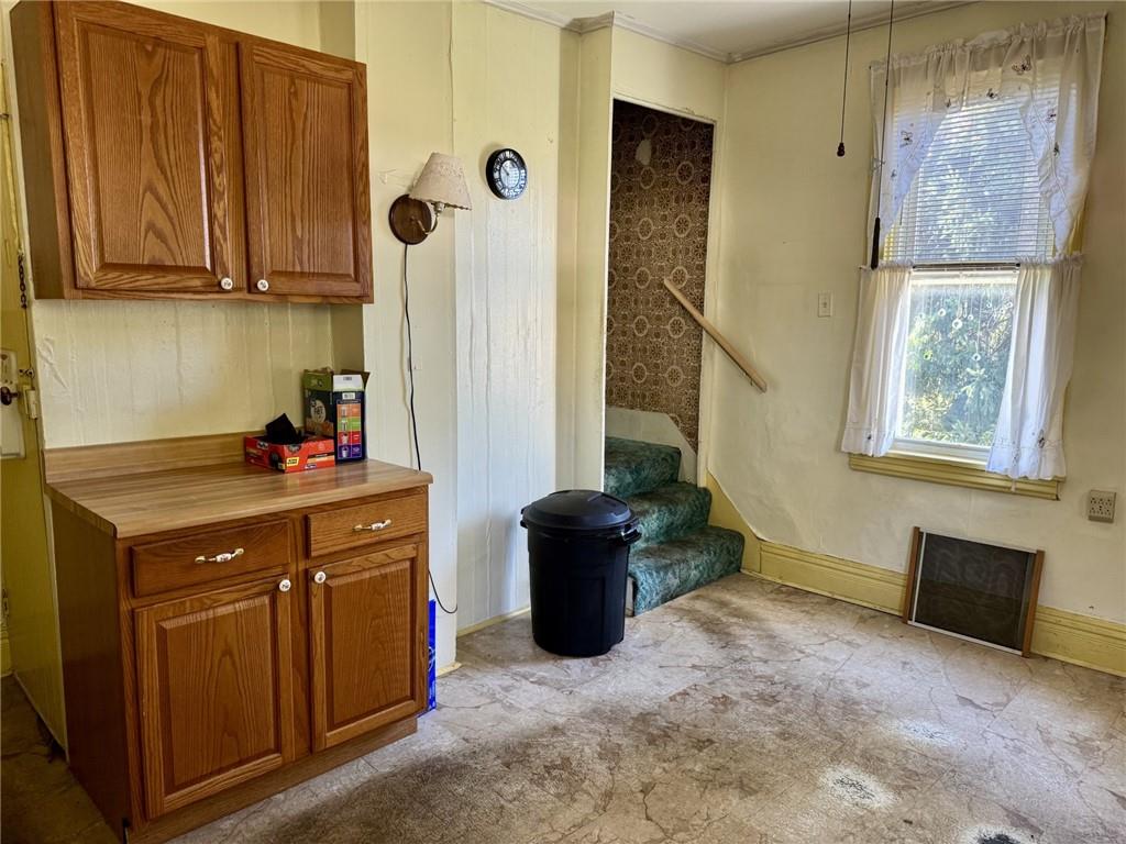 609 Lincoln Street Rochester, PA 15074 - Photo 6 of 24 a kitchen with a refrigerator and a stove top oven