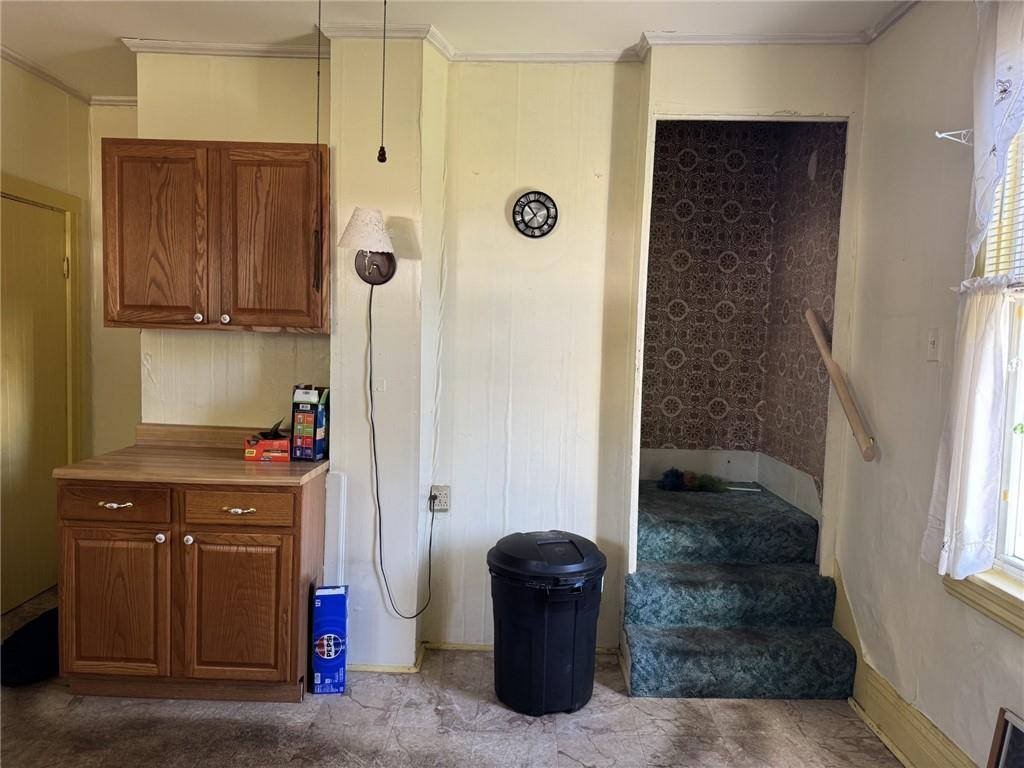 609 Lincoln Street Rochester, PA 15074 - Photo 7 of 24 a kitchen with a refrigerator and a table