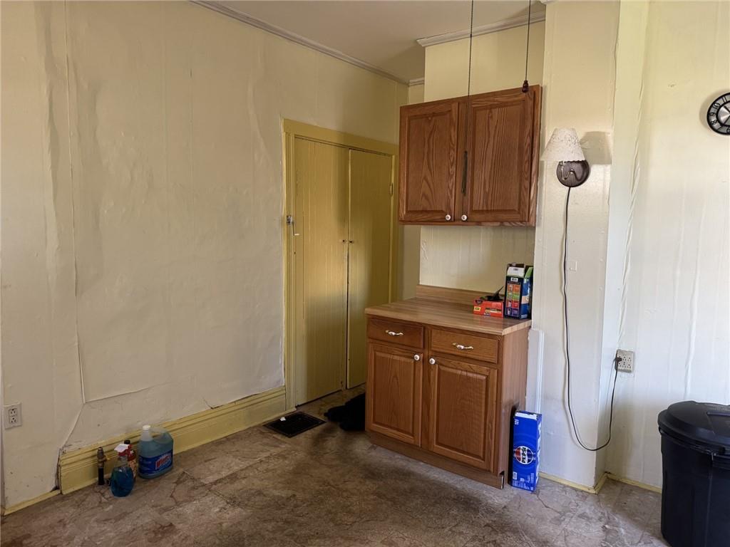 609 Lincoln Street Rochester, PA 15074 - Photo 8 of 24 a kitchen with a sink and a refrigerator