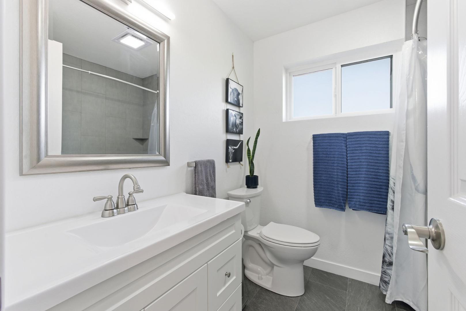 36975 North Sunset Trail Cave Creek, AZ 85331 - Photo 11 of 27 a bathroom with a toilet a sink and mirror
