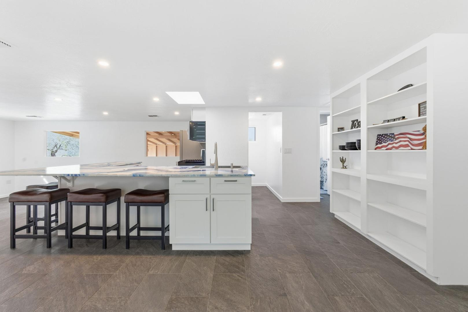 36975 North Sunset Trail Cave Creek, AZ 85331 - Photo 12 of 27 a kitchen with white cabinets and chairs