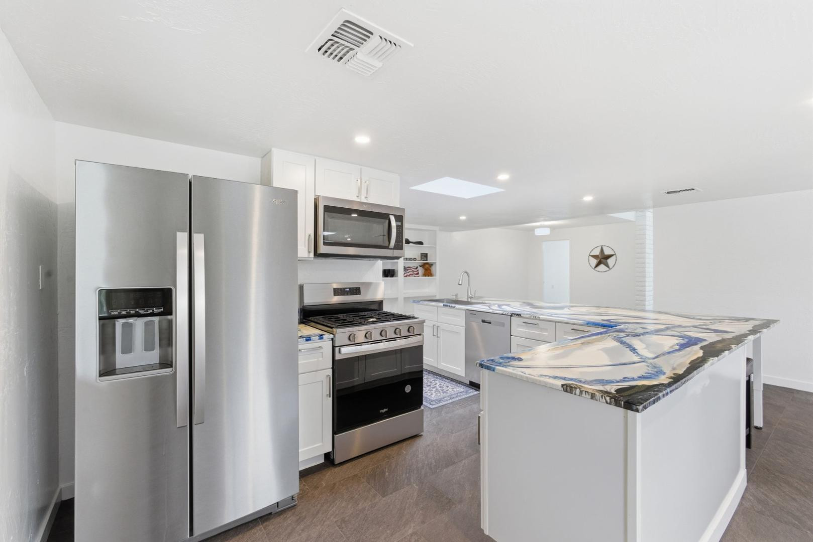 36975 North Sunset Trail Cave Creek, AZ 85331 - Photo 14 of 27 a kitchen that has a sink cabinets stainless steel appliances and a counter top space