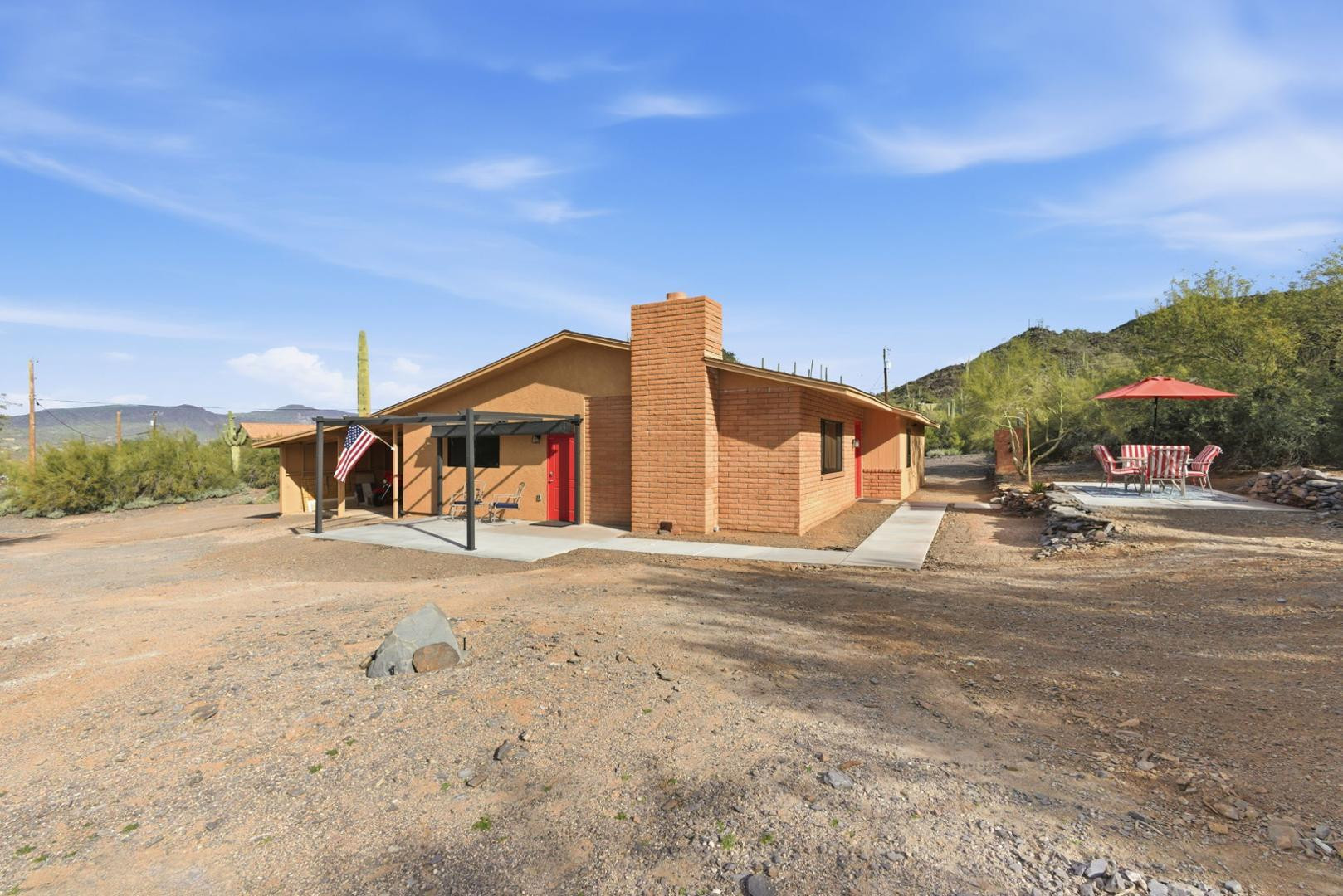 36975 North Sunset Trail Cave Creek, AZ 85331 - Photo 3 of 27 a front view of a house with a yard and garage
