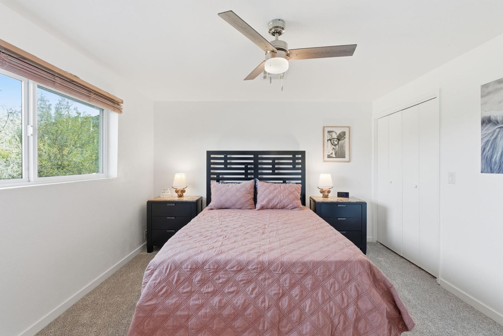 36975 North Sunset Trail Cave Creek, AZ 85331 - Photo 9 of 27 a bedroom with a large bed and a large window