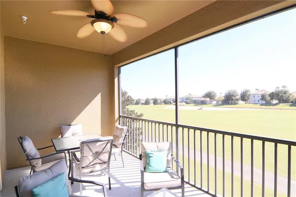 a view of a balcony with furniture