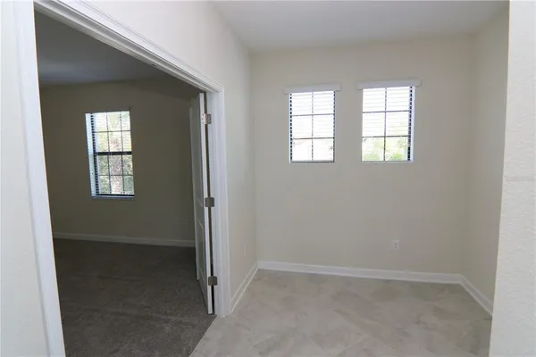 an empty room that has a window