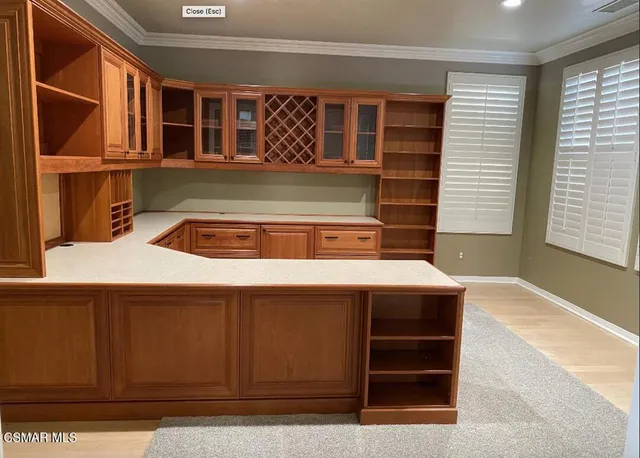 a kitchen with a sink a cabinets and window