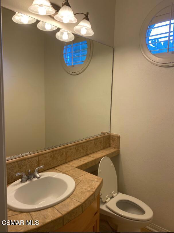 3082 Eaglewood Avenue Thousand Oaks, CA 91362 - Photo 21 of 29 a bathroom with a sink mirror and toilet