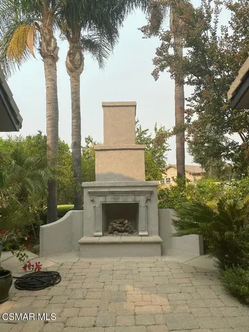 a white building with trees in front of it