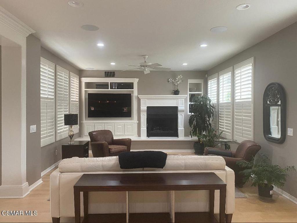 3082 Eaglewood Avenue Thousand Oaks, CA 91362 - Photo 8 of 29 a living room with furniture a flat screen tv and a large window