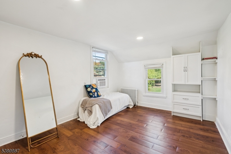 385 Ridge Road Dayton, NJ 08810 - Photo 12 of 14 a bedroom with a bed and a mirror