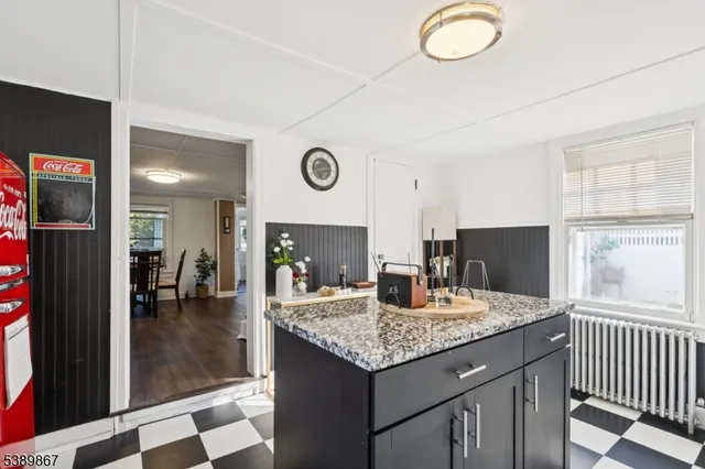 a kitchen with a table and chairs