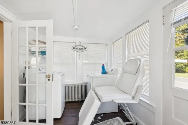 a work room with furniture and windows