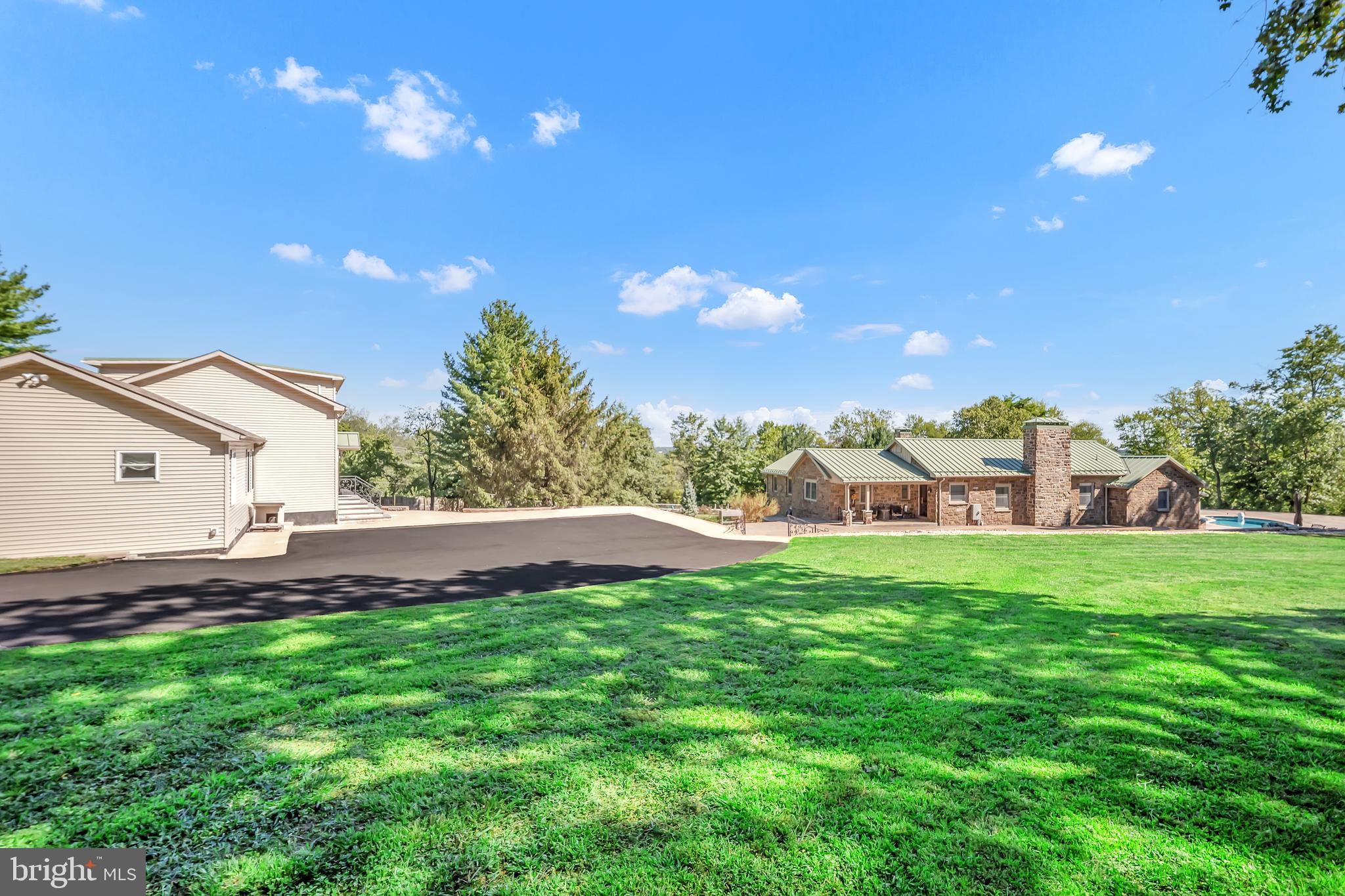 1851 Meetinghouse Road Warminster, PA 18974 - Photo 11 of 66 a view of a big yard with a house in the background