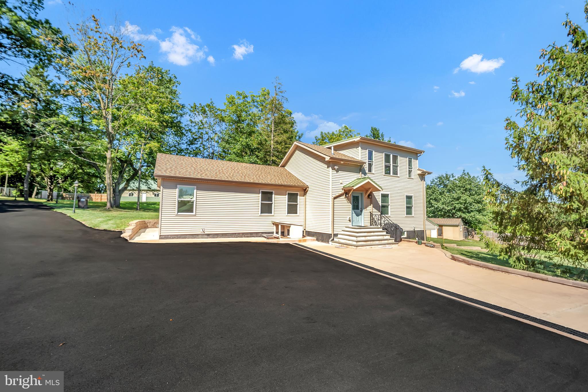 1851 Meetinghouse Road Warminster, PA 18974 - Photo 12 of 66 a front view of a house with a yard and garage