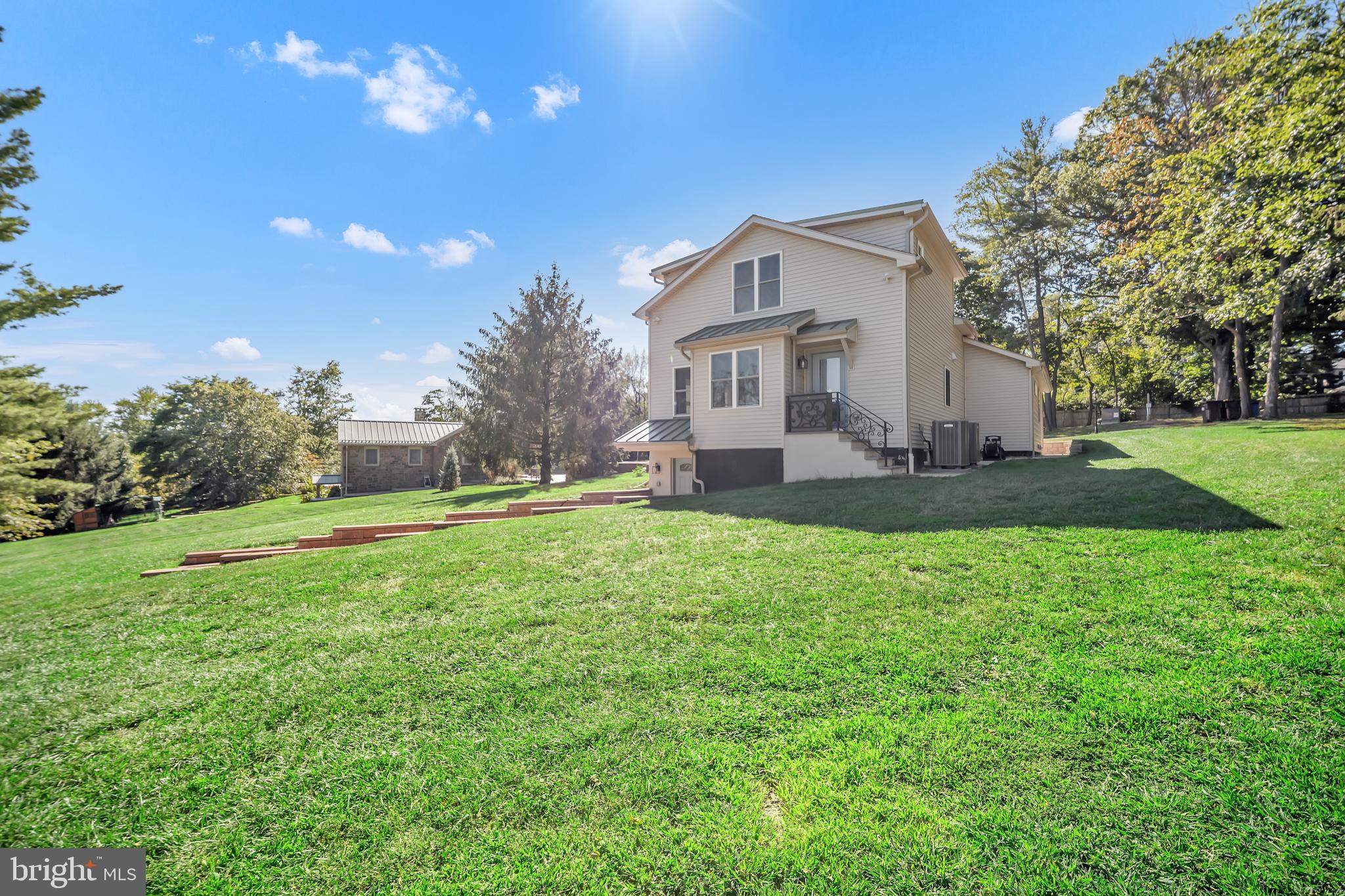 1851 Meetinghouse Road Warminster, PA 18974 - Photo 19 of 66 a white house with a big yard plants and large trees