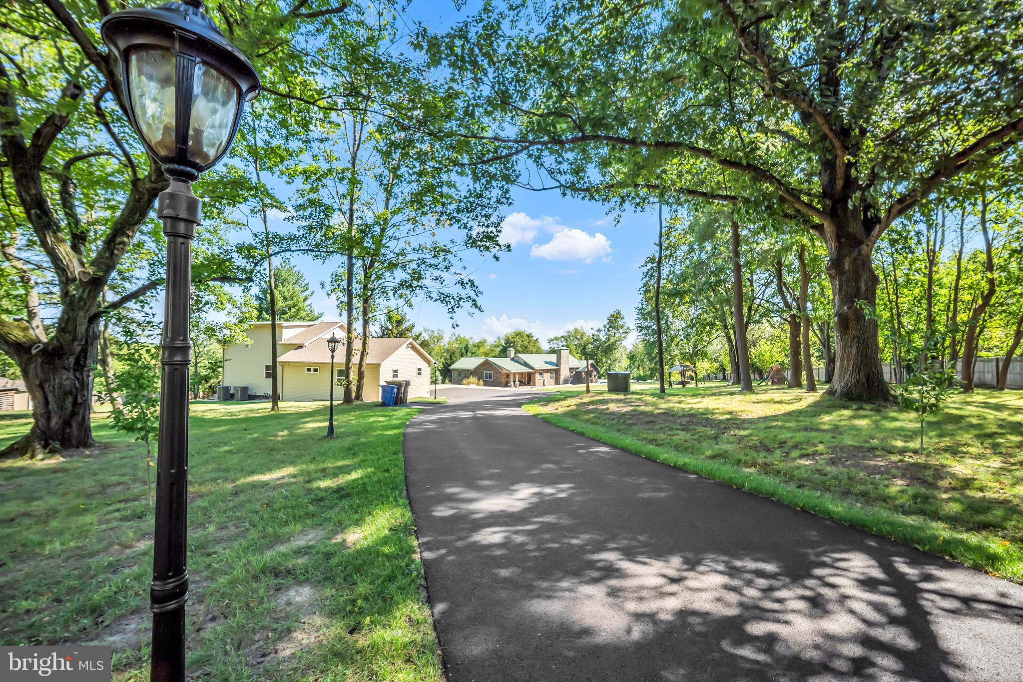 1851 Meetinghouse Road Warminster, PA 18974 - Photo 23 of 66 a view of a yard with plants and trees